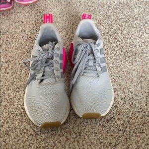 Grey and pink Adidas NMD shoes